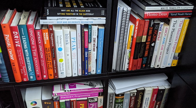 A bunch of professional development books on a shelf